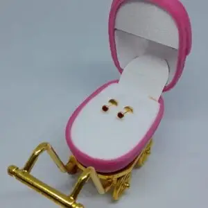 Abridor con piedra roja